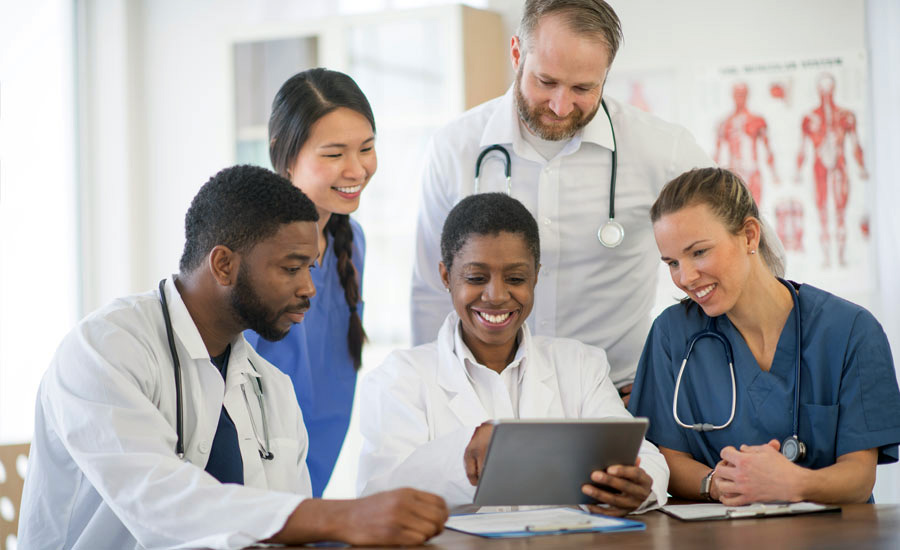 Health professionals reviewing information - Credit: iStock